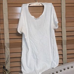 White shirt with whole in back.